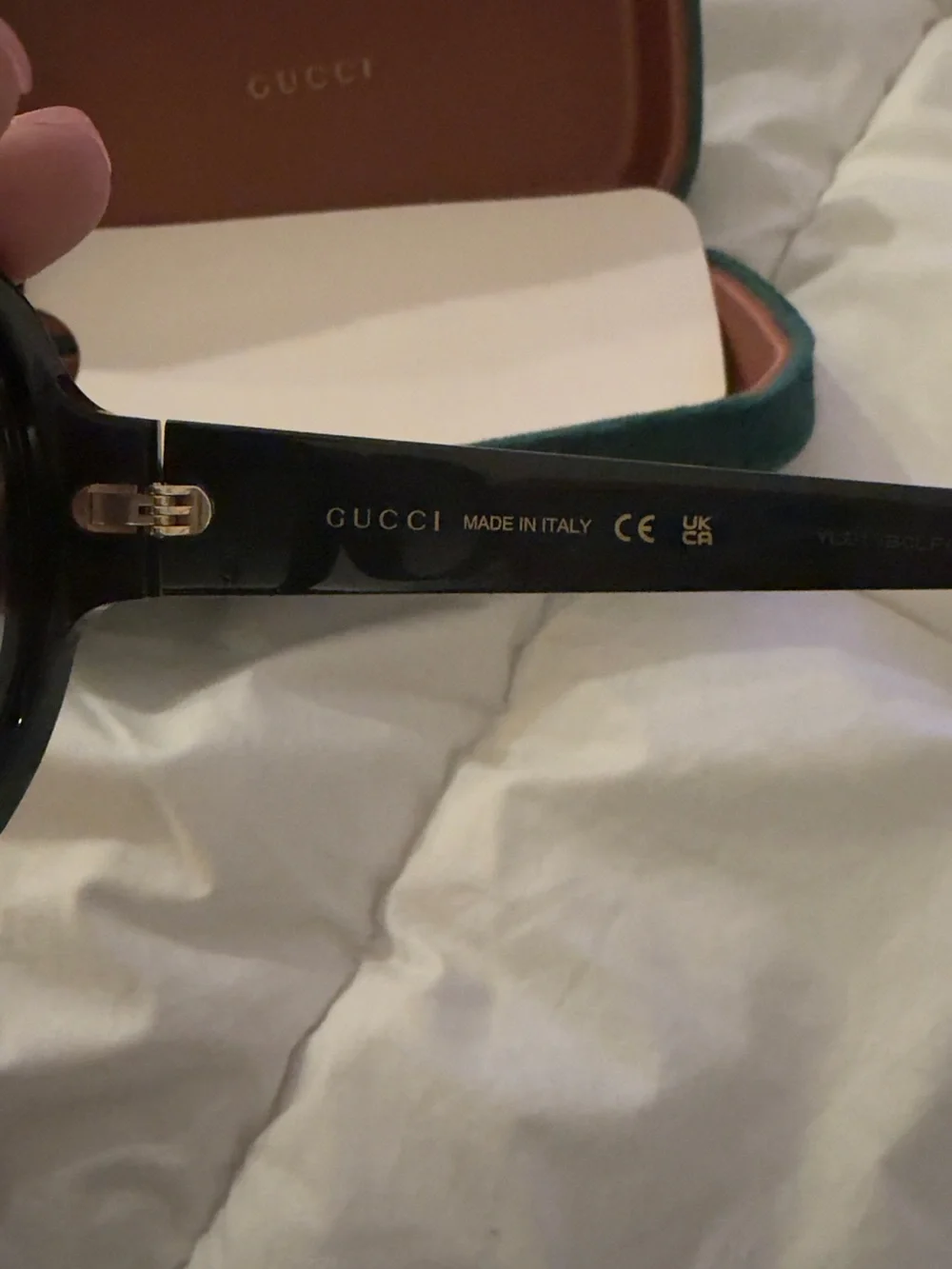 Gucci Black Round Sunglasses with Gold Logo Accent